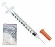 disposable syringe and Heroin